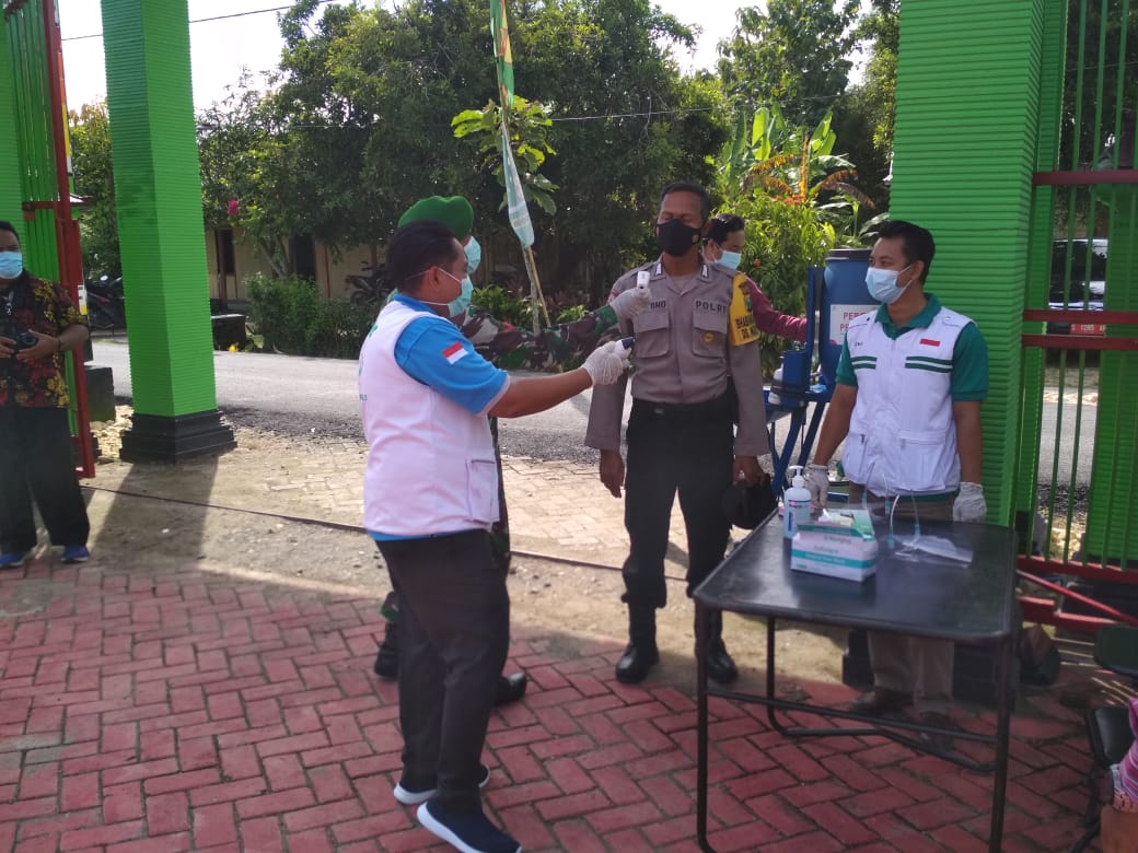 Cegah Penyebaran Covid-19, Babhinkamtibmas Desa Ngrancang Tak Luput Pengecekan Suhu Tubuh